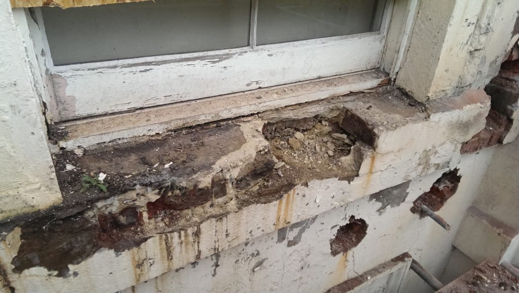 Damage to a window from fire escape