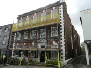 Front of large Victorian building on Lewes High Street with scaffolding