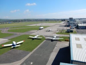 Aerial view of planes and runway at Shoreham Airport