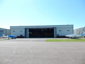 Premier House, Hangar 1, Shoreham Airport shot from a distance - doors open